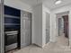 Convenient laundry area with modern washer/dryer units and nearby storage at 2137 Whispering Way, Charlotte, NC 28212