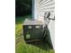 Exterior image of the home's air conditioning unit, with partial view of the siding at 215 9Th St, Spencer, NC 28159