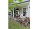 Inviting front porch featuring a porch swing, vintage bicycle, and decorative accents at 215 9Th St, Spencer, NC 28159