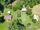 A beautiful countryside view of a home with barns surrounded by lush greenery at 233 Hicks Rd, Statesville, NC 28625