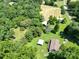 Overhead view of the property featuring green landscape and various outbuildings at 233 Hicks Rd, Statesville, NC 28625