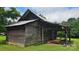 Rustic barn with weathered wood and a partial lean-to, providing a glimpse into its potential for storage or renovation at 233 Hicks Rd, Statesville, NC 28625