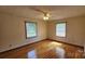 Spacious bedroom with hardwood floors and natural light from two windows at 233 Hicks Rd, Statesville, NC 28625