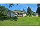 Quaint home featuring a welcoming front porch, manicured landscaping, and an adjacent gazebo at 233 Hicks Rd, Statesville, NC 28625