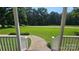 View from the porch showcasing a beautifully maintained front lawn with a sidewalk and decorative landscaping at 233 Hicks Rd, Statesville, NC 28625