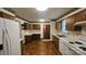 Well-lit kitchen featuring wood cabinetry and practical layout at 233 Hicks Rd, Statesville, NC 28625