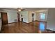 Open living room with hardwood floors and seamless flow to other spaces at 233 Hicks Rd, Statesville, NC 28625