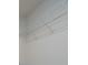 A wire shelf attached to the wall inside of a closet at 2407 Baxter Se Pl, Concord, NC 28025