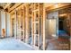 Interior view of an unfinished room, showing the framing and structure at 2407 Baxter Se Pl, Concord, NC 28025