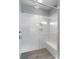 Modern walk-in shower with sleek subway tile, glass enclosure, and built-in bench at 252 Broadleaf Dr, Denver, NC 28037
