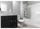 Bright bathroom with a modern vanity, stylish mirror, and a shower-tub combo for comfortable living at 252 Broadleaf Dr, Denver, NC 28037