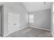 Spacious bedroom with vaulted ceiling, plush carpet, and window at 252 Broadleaf Dr, Denver, NC 28037