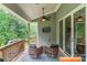 Relaxing covered deck with ceiling fan and comfortable seating, perfect for outdoor entertaining at 252 Broadleaf Dr, Denver, NC 28037