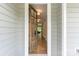 Welcoming doorway reveals the hardwood hallway and cozy living room of this beautiful home at 252 Broadleaf Dr, Denver, NC 28037