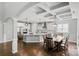 Open-concept kitchen and dining area with a large island, stainless steel appliances, and hardwood floors at 252 Broadleaf Dr, Denver, NC 28037