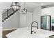 Modern kitchen island with stainless steel appliances and elegant pendant lighting at 252 Broadleaf Dr, Denver, NC 28037