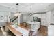 Open-concept living space featuring a kitchen, dining area, and staircase at 252 Broadleaf Dr, Denver, NC 28037