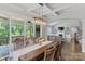 Open-concept living space with a dining area and access to the outdoor deck and living room at 252 Broadleaf Dr, Denver, NC 28037