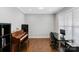 Comfortable home office featuring hardwood floors, natural light, and modern desk setup at 252 Broadleaf Dr, Denver, NC 28037