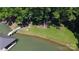 Lush backyard with lakeside access, a fire pit, and easy access to docks and lake activities at 2721 Nance Cove Rd, Charlotte, NC 28214