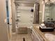 Bright bathroom featuring a shower-tub combination with a patterned shower curtain and double sink vanity at 2721 Nance Cove Rd, Charlotte, NC 28214