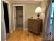Bedroom with an open closet and hardwood flooring, with a chest-of-drawers at 2721 Nance Cove Rd, Charlotte, NC 28214