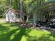 Detached garage with roll up door and metal car port provide ample storage at 2721 Nance Cove Rd, Charlotte, NC 28214