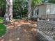 Well-maintained side yard with stepping stone path, car port and manicured lawn at 2721 Nance Cove Rd, Charlotte, NC 28214