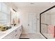 Bright bathroom featuring a walk-in shower with glass door and a double sink vanity at 3006 Khan Park Dr # 69, Charlotte, NC 28206