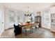 Bright dining room features hardwood floors, dining table, and windows at 3006 Khan Park Dr # 69, Charlotte, NC 28206