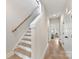 Clean hallway with wood floors, leading to other rooms, with white trim and natural light at 3006 Khan Park Dr # 69, Charlotte, NC 28206