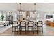 Bright kitchen with white cabinets, stainless steel appliances, and island seating at 3006 Khan Park Dr # 69, Charlotte, NC 28206
