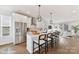 Island kitchen boasts stainless appliances, white cabinets, and seating at 3006 Khan Park Dr # 69, Charlotte, NC 28206