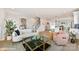 Bright living room features modern decor, a stylish sofa, hardwood floors, and an open floor plan at 3006 Khan Park Dr # 69, Charlotte, NC 28206
