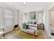 Bright bedroom featuring two windows, a king bed, and hardwood floors for a comfortable, naturally lit space at 3010 Khan Park Dr # 68, Charlotte, NC 28206