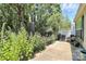 Landscaped backyard featuring a patio area, lush greenery and a bird feeder at 3079 Azalea Dr, Fort Mill, SC 29707