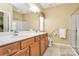 Bright bathroom with double sink vanity, shower, toilet and accessibility features at 3079 Azalea Dr, Fort Mill, SC 29707