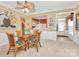 Cozy dining area features a glass-top table with seating for four and easy access to the kitchen and front door at 3079 Azalea Dr, Fort Mill, SC 29707
