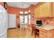 Inviting dining area with hardwood floors, bright windows, and a designated workspace, offering versatility and comfort at 3079 Azalea Dr, Fort Mill, SC 29707