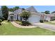 Charming home with manicured lawn, flower beds, and a two-car garage, located in a desirable community at 3079 Azalea Dr, Fort Mill, SC 29707