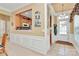 Inviting hallway with wainscoting, tile flooring, and views into the kitchen, offering a glimpse of the home's layout at 3079 Azalea Dr, Fort Mill, SC 29707