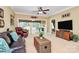 Comfortable living room with hardwood furniture, a large TV, and backyard access through a glass-paned doorway at 3079 Azalea Dr, Fort Mill, SC 29707