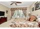 Comfortable main bedroom featuring a ceiling fan, window, and decorative touches at 3079 Azalea Dr, Fort Mill, SC 29707