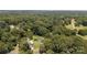 Lush, wooded acreage featuring a serene pool, complementing a beautiful and cozy home with driveway and carport at 3419 Boat Club Rd, Belmont, NC 28012
