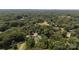 Beautiful aerial view showcasing the homes nestled within lush green trees, as well as a gorgeous pool and carport at 3419 Boat Club Rd, Belmont, NC 28012