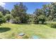 Large and sprawling backyard with a storage shed, surrounded by trees at 3419 Boat Club Rd, Belmont, NC 28012