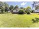 Expansive backyard featuring lush greenery and mature trees providing ample shade and privacy at 3419 Boat Club Rd, Belmont, NC 28012