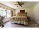 Cozy bedroom featuring carpet floors, a ceiling fan, and natural light at 3419 Boat Club Rd, Belmont, NC 28012