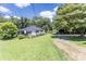 Charming home with a screened front porch, garage, and a spacious green lawn, perfect for outdoor enjoyment at 3419 Boat Club Rd, Belmont, NC 28012