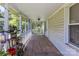 Inviting, spacious screened porch with a variety of potted plants and outdoor decor adding character at 3419 Boat Club Rd, Belmont, NC 28012
